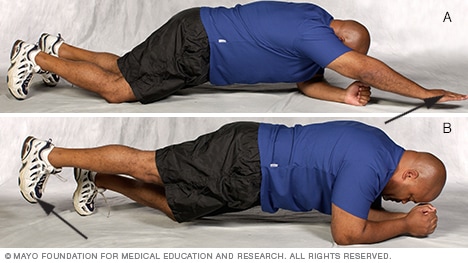 Man doing modified plank core-strength exercise variations