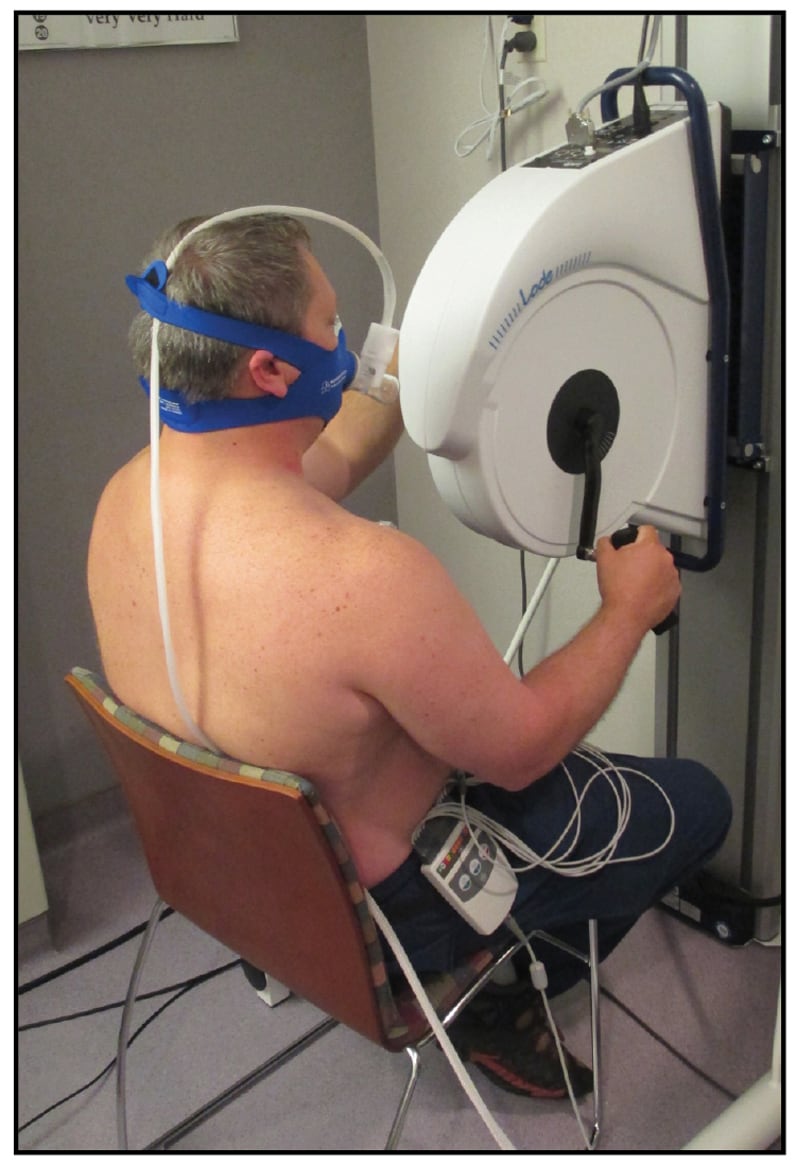 Image of seated arm ergometer stress testing with oxygen consumption