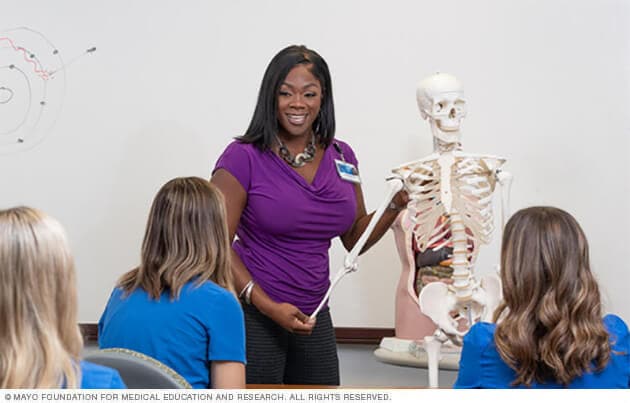 A Mayo Clinic medical instructor demonstrates an aspect of orthopedic anatomy in a class session.