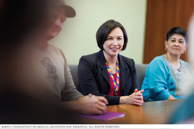 A research physician speaks with parents.