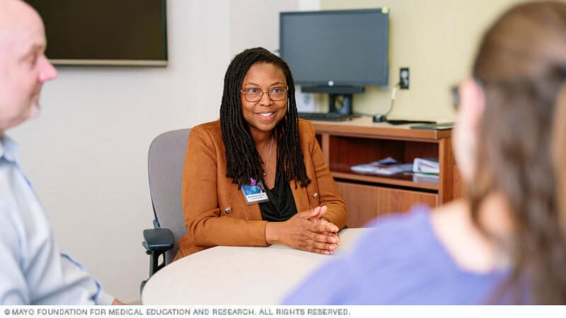 An initial Pain Rehabilitation Center takes place at a table.