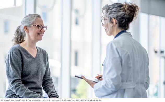 A woman consults with her doctor